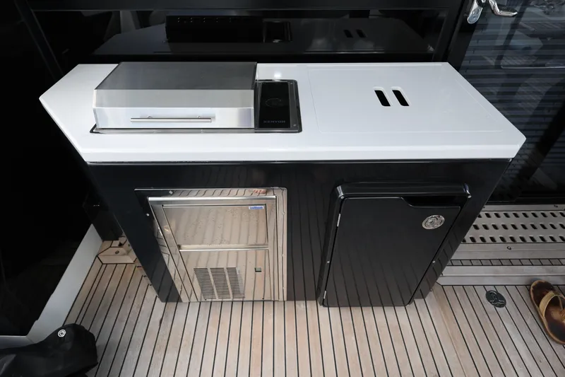  Yacht Photos Pics Outdoor kitchen on 2019 Galeon 650 Sky yacht with grill and storage.