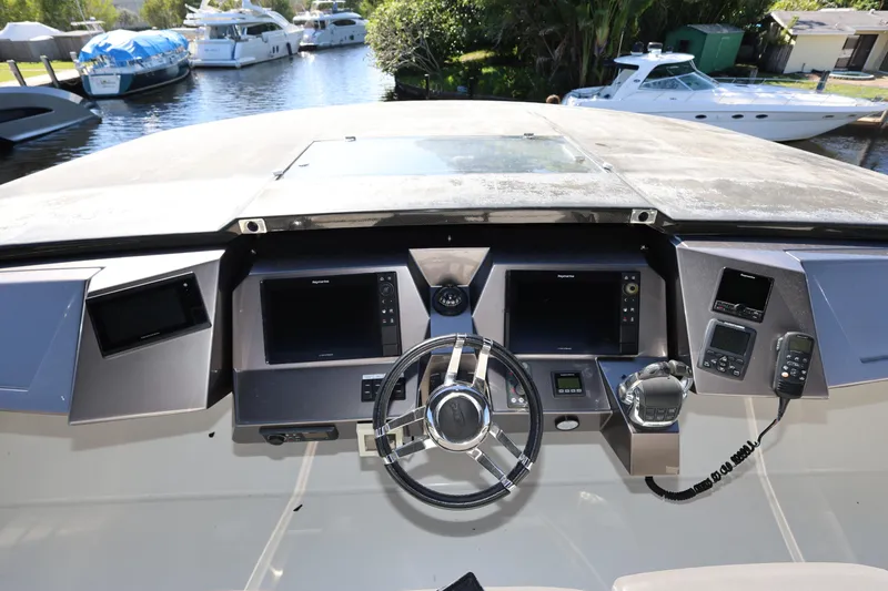  Yacht Photos Pics Cockpit of 2019 Galeon 650 Sky yacht with advanced navigation systems and steering wheel.
