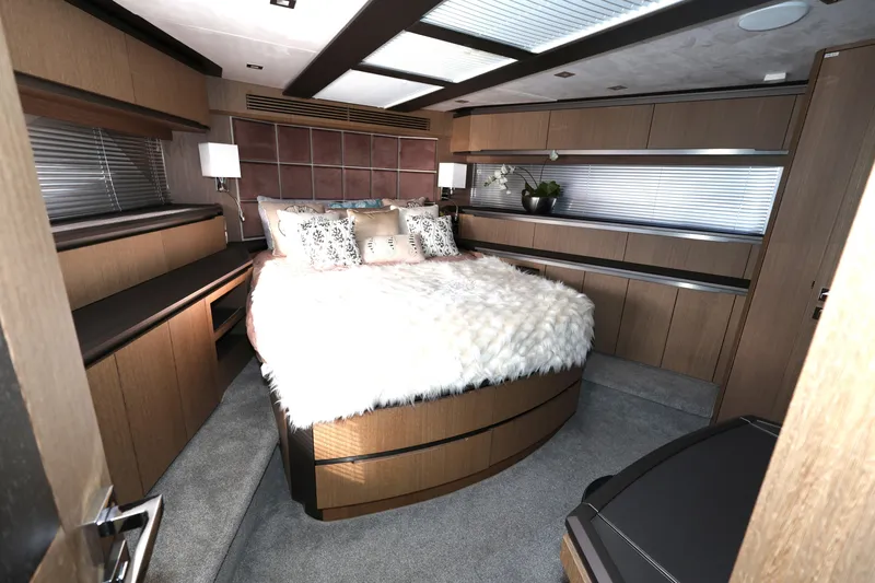  Yacht Photos Pics Luxurious bedroom interior of 2019 Galeon 650 Sky yacht with modern design and cozy bedding.