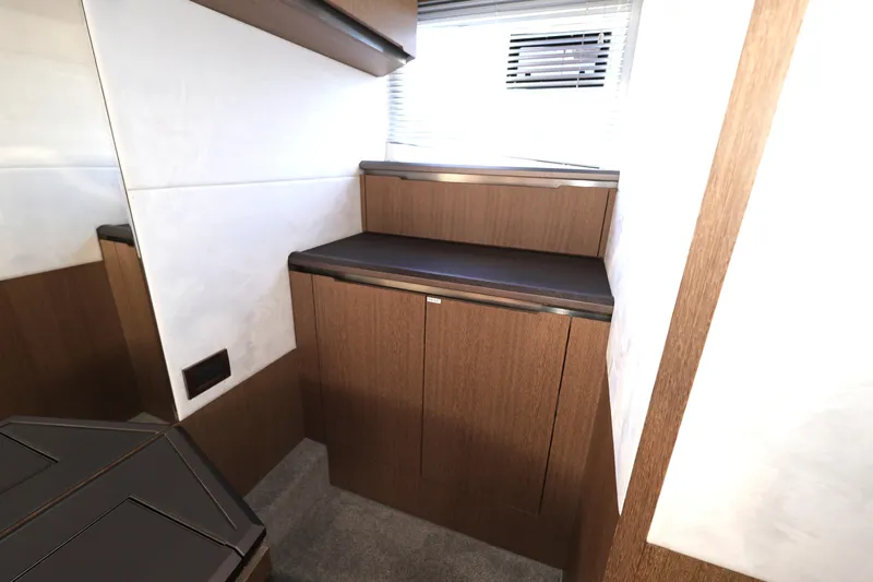  Yacht Photos Pics Interior of 2019 Galeon 650 Sky yacht with sleek wooden cabinetry and modern design.