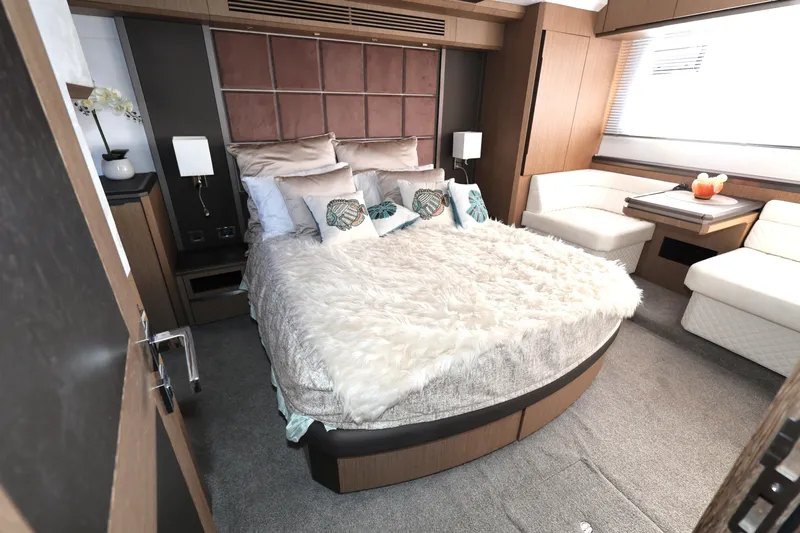  Yacht Photos Pics Luxurious bedroom interior of 2019 Galeon 650 Sky yacht with plush bedding and modern decor.