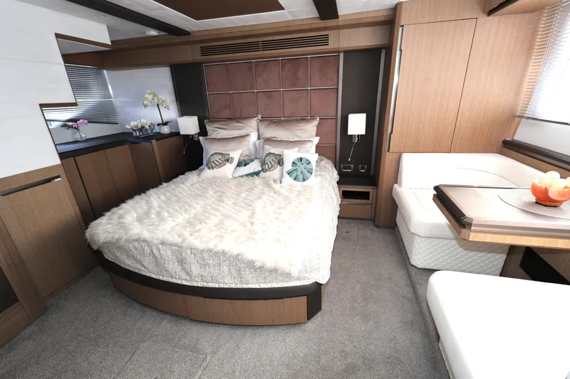  Yacht Photos Pics Luxurious bedroom interior of 2019 Galeon 650 Sky yacht with modern furnishings.