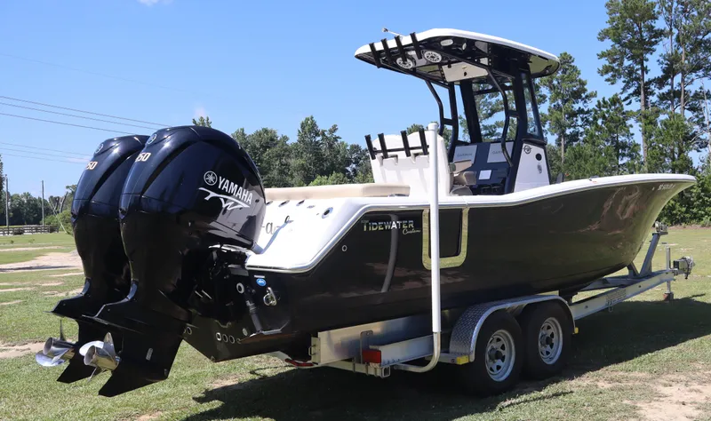  Yacht Photos Pics 2022 Tidewater 272 LXF boat with dual Yamaha engines on a trailer.