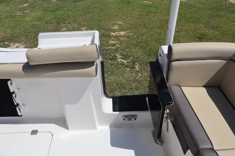  Yacht Photos Pics 2022 Tidewater 272 LXF boat interior with beige seating and sleek design.