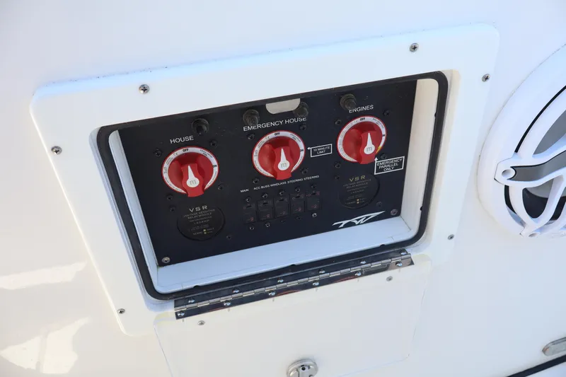  Yacht Photos Pics Control panel of 2022 Tidewater 272 LXF boat with red switches and speaker.