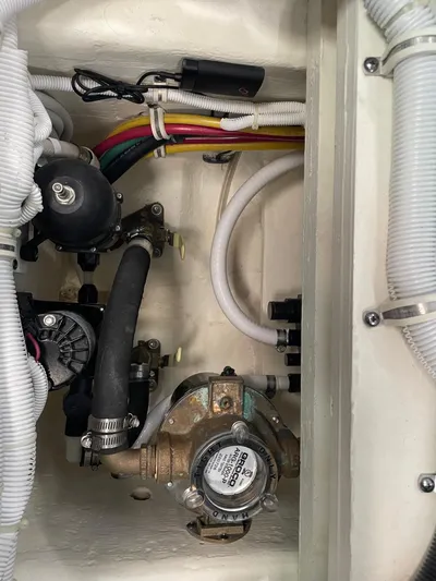Salty Suite Yacht Photos Pics Engine compartment of 2023 Tiara Yachts C44 Coupe with visible wiring and components.