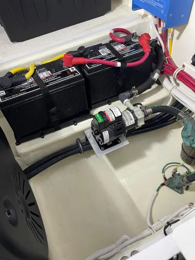 Salty Suite Yacht Photos Pics 2023 Tiara Yachts C44 Coupe engine compartment with batteries and wiring.