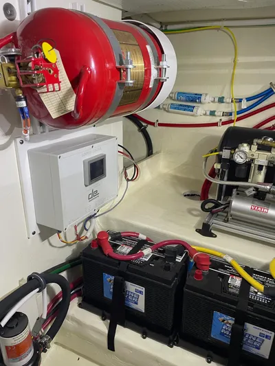Salty Suite Yacht Photos Pics 2023 Tiara Yachts C44 Coupe engine room with fire suppression system and batteries.