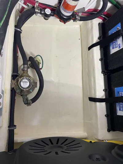 Salty Suite Yacht Photos Pics 2023 Tiara Yachts C44 Coupe engine compartment with battery setup and wiring.