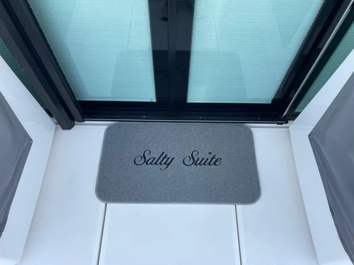 Salty Suite Yacht Photos Pics Doormat on Tiara Yachts 2023 C44 Coupe with Salty Suite text.