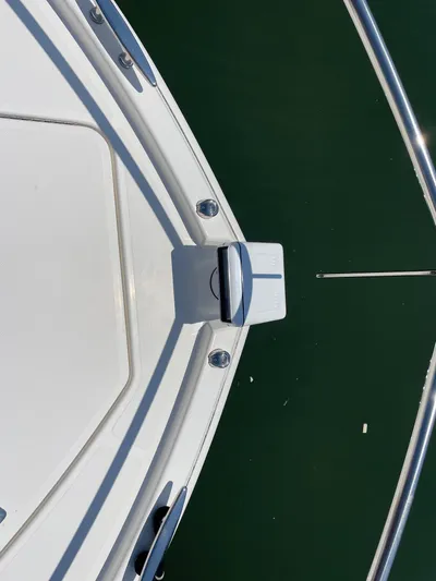 Salty Suite Yacht Photos Pics 2023 Tiara Yachts C44 Coupe bow detail with stainless steel railings.