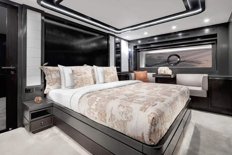  Yacht Photos Pics Luxurious bedroom interior of 2024 Sirena 68 yacht with elegant bedding and modern design.