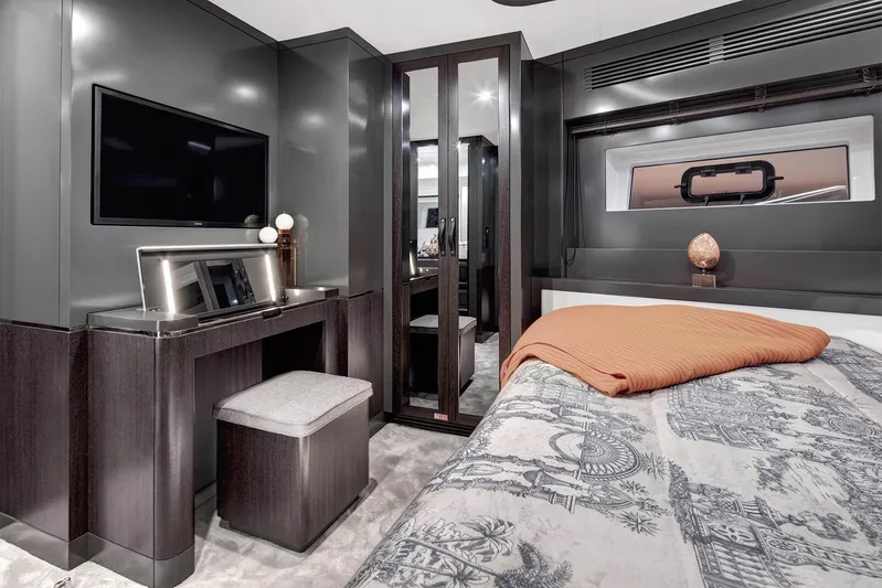  Yacht Photos Pics Luxurious 2024 Sirena 68 yacht bedroom with modern decor and elegant furnishings.