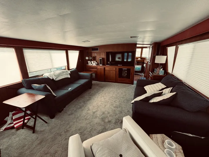 Carol Ann Yacht Photos Pics Interior of 1984 Hatteras 53 Motor Yacht with cozy seating and entertainment area.
