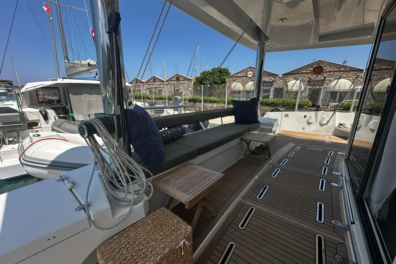  Yacht Photos Pics Spacious deck of 2019 Bali 5.4 yacht with seating and wooden flooring.