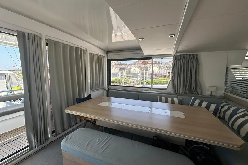  Yacht Photos Pics Interior of 2019 Bali 5.4 yacht with dining area and large windows.
