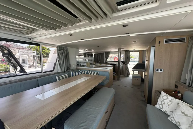  Yacht Photos Pics Spacious interior of 2019 Bali 5.4 catamaran with modern furnishings and large windows.