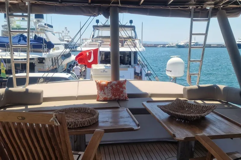  Yacht Photos Pics Luxurious Bali 5.4 yacht interior with wooden furniture, docked at a marina, 2019 model.