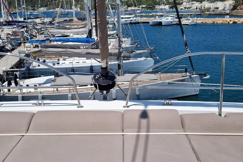 Yacht Photos Pics 2019 Bali 5.4 yacht docked in a marina with other boats in the background.