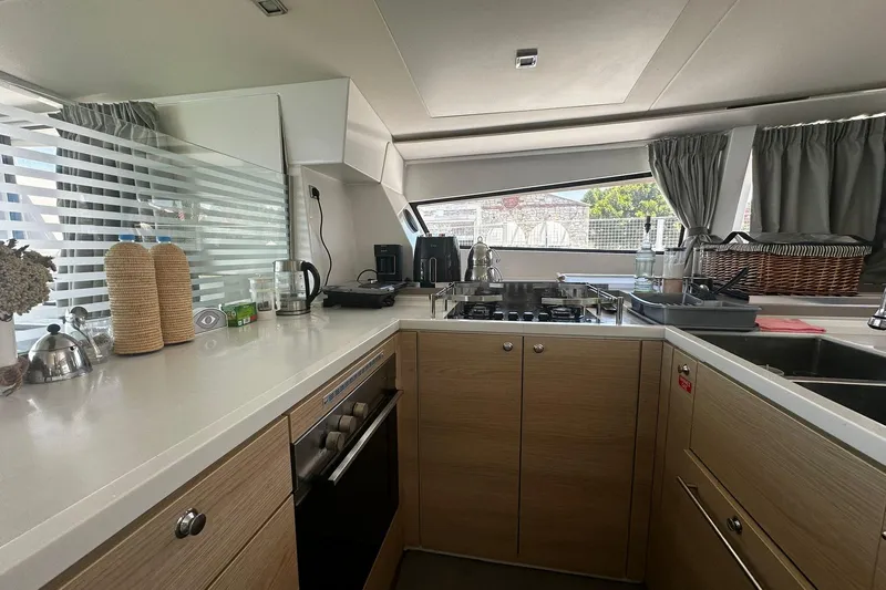  Yacht Photos Pics Modern kitchen interior on a 2019 Bali 5.4 yacht, featuring sleek countertops and appliances.