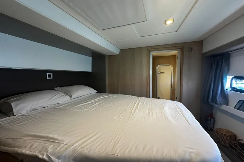  Yacht Photos Pics Luxurious bedroom interior of 2019 Bali 5.4 yacht with cozy bedding and modern design.