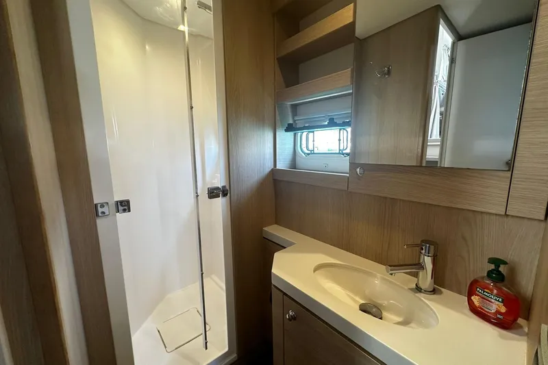  Yacht Photos Pics Modern bathroom in 2019 Bali 5.4 yacht with shower, sink, and wooden cabinetry.