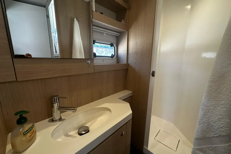  Yacht Photos Pics Modern bathroom in 2019 Bali 5.4 yacht with sink, mirror, and shower.