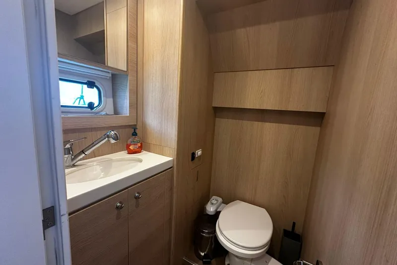  Yacht Photos Pics Modern bathroom in 2019 Bali 5.4 yacht with sink, toilet, and wooden cabinetry.