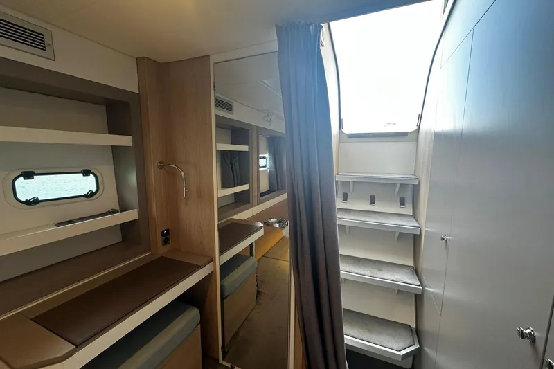  Yacht Photos Pics Modern interior of 2019 Bali 5.4 yacht with stairs and shelving.