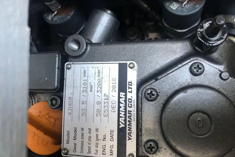  Yacht Photos Pics Engine label on a Yanmar motor, showing specifications and manufacturing details.
