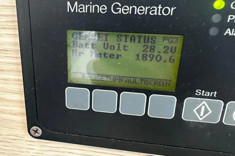  Yacht Photos Pics Marine generator display showing battery voltage and hour meter readings.