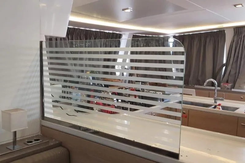  Yacht Photos Pics Interior of 2019 Bali 5.4 yacht with modern kitchen and striped glass partition.