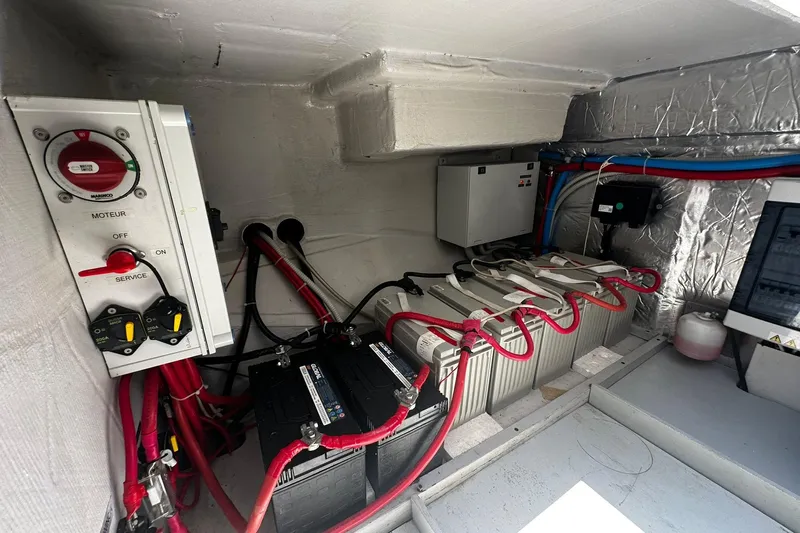  Yacht Photos Pics Electrical system in a 2019 Bali 5.4 yacht, featuring batteries and control panel.