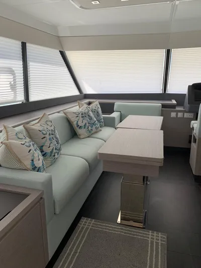 Yacht Photos Pics 2024 Fountaine Pajot MY5 yacht interior with modern sofa and elegant decor.