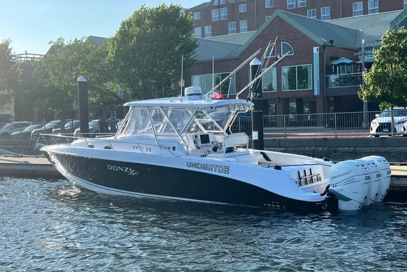  Yacht Photos Pics 2004 Donzi 38 ZSF boat docked at marina with triple Mercury outboard engines.