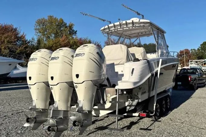  Yacht Photos Pics 2004 Donzi 38 ZSF boat with triple 350 horsepower engines on a trailer.