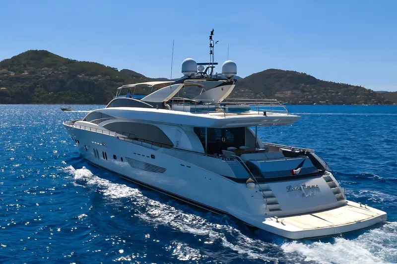 Lady Emma Yacht Photos Pics Luxurious 2007 Guy Couach 3300 Fly yacht cruising in clear blue waters.