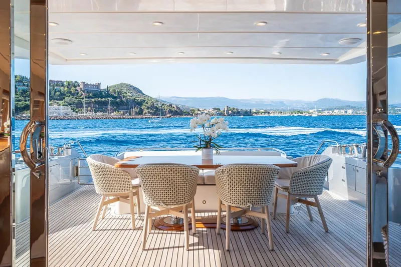 Lady Emma Yacht Photos Pics Luxurious 2007 Guy Couach 3300 Fly yacht deck with elegant dining area and ocean view.