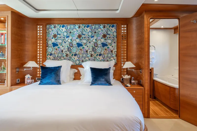 Lady Emma Yacht Photos Pics Luxurious bedroom on 2007 Guy Couach 3300 Fly yacht with elegant decor and ensuite bathroom.