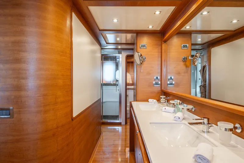 Lady Emma Yacht Photos Pics Luxurious bathroom interior of 2007 Guy Couach 3300 Fly yacht with wooden finishes.
