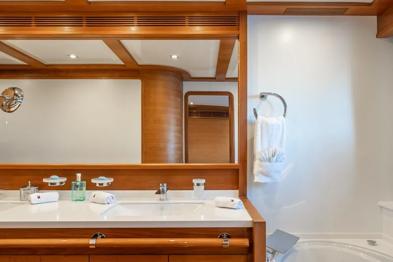Lady Emma Yacht Photos Pics Luxurious bathroom interior on 2007 Guy Couach 3300 Fly yacht, featuring elegant wood accents.