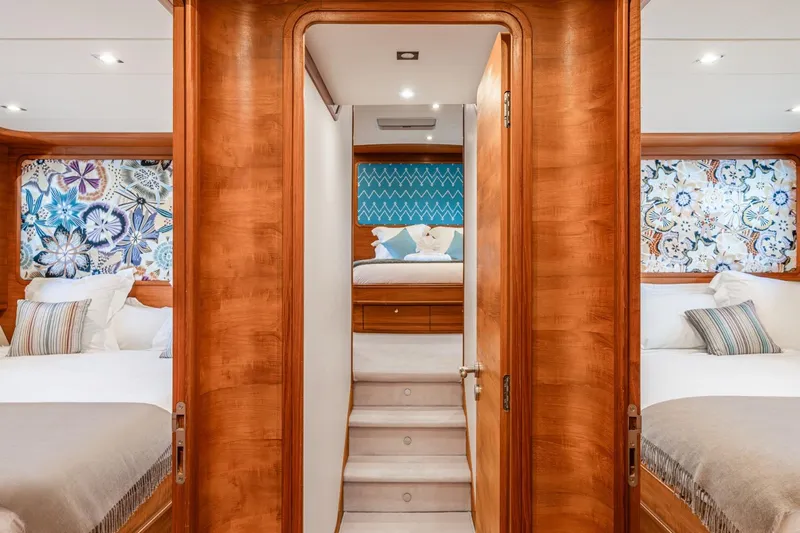 Lady Emma Yacht Photos Pics Luxurious interior of 2007 Guy Couach 3300 Fly yacht with elegant wood finishes and floral decor.