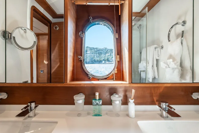 Lady Emma Yacht Photos Pics Luxurious bathroom on 2007 Guy Couach 3300 Fly yacht with ocean view porthole.
