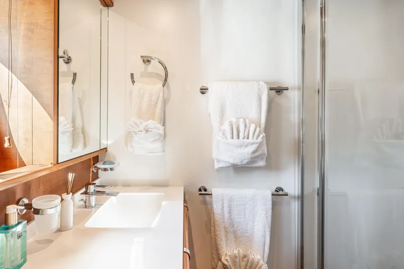 Lady Emma Yacht Photos Pics Luxurious bathroom in 2007 Guy Couach 3300 Fly yacht with elegant fixtures and towels.