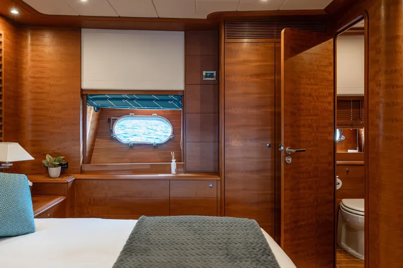 Lady Emma Yacht Photos Pics Luxurious 2007 Guy Couach 3300 Fly yacht cabin with elegant wood interior and ocean view.