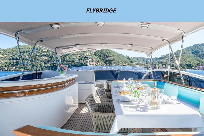 Lady Emma Yacht Photos Pics Flybridge of 2007 Guy Couach 3300 Fly yacht with elegant dining setup.