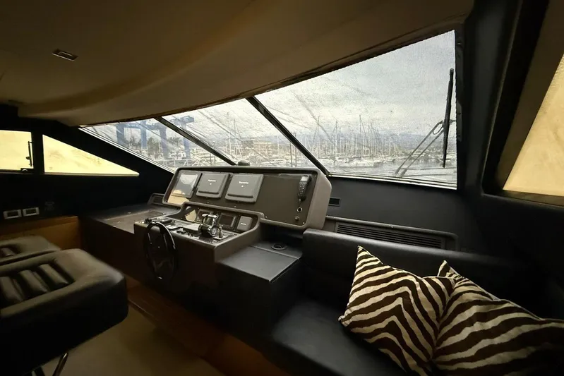  Yacht Photos Pics 2007 Ferretti Yachts 731 helm with modern controls and zebra-patterned cushion.