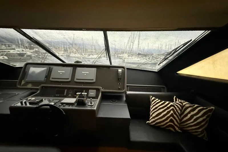  Yacht Photos Pics 2007 Ferretti Yachts 731 helm with navigation screens and zebra-patterned cushions.