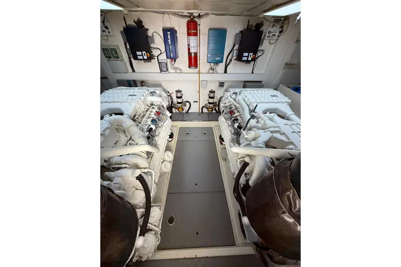  Yacht Photos Pics Engine room of 2007 Ferretti Yachts 731, featuring dual engines and safety equipment.