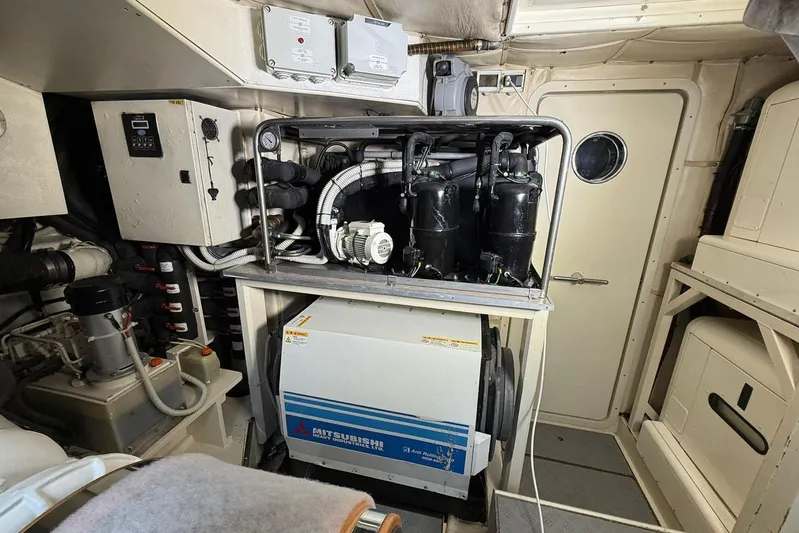 Yacht Photos Pics Engine room of 2007 Ferretti Yachts 731, featuring Mitsubishi equipment and complex piping system.
